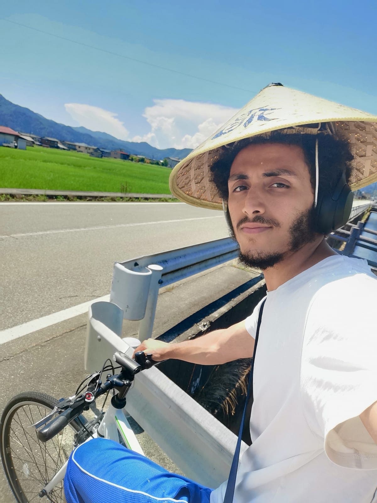 A rented bike, the hat, and rice fields until the train.