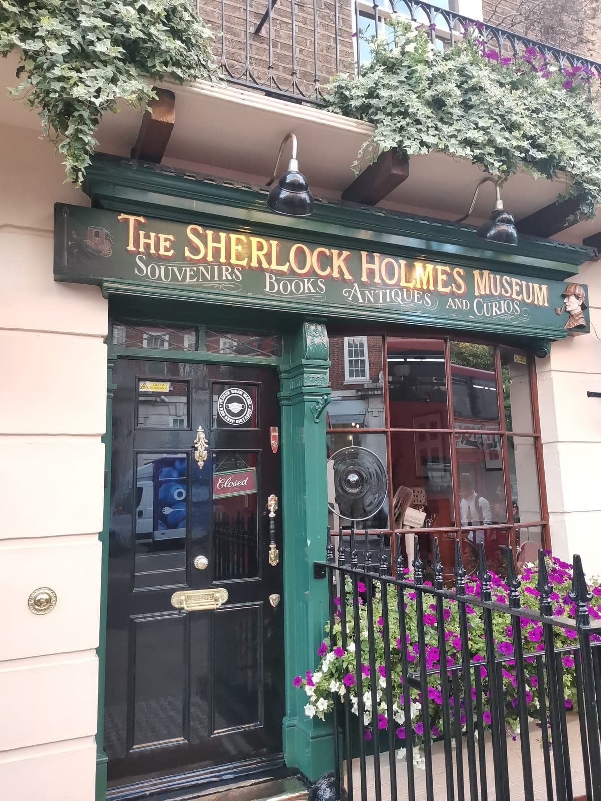 Sherlock Holmes’ door at 221B Baker Street, then Regent Street as the light fades.