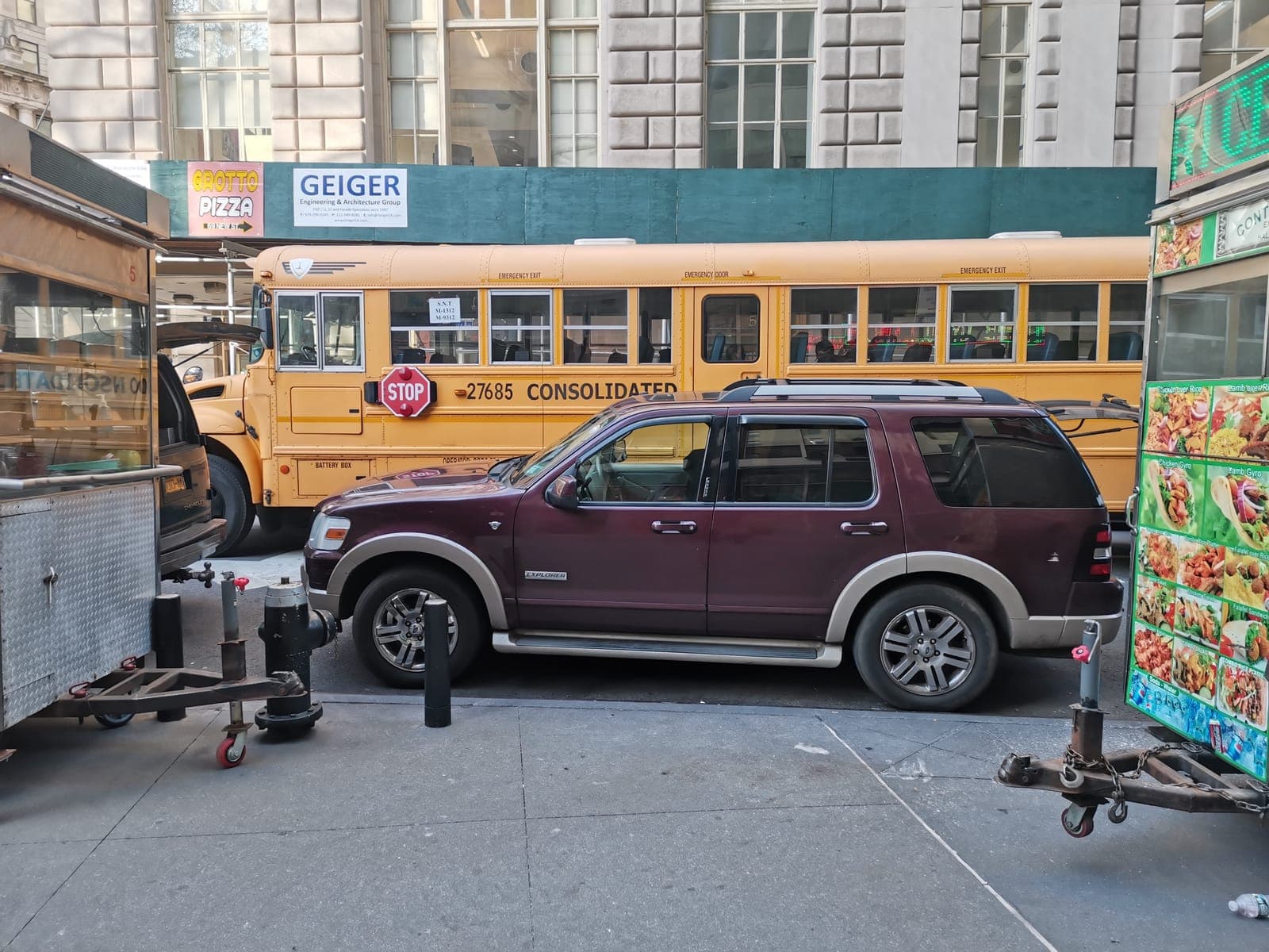 The New York Stock Exchange, and a yellow school bus two streets away.