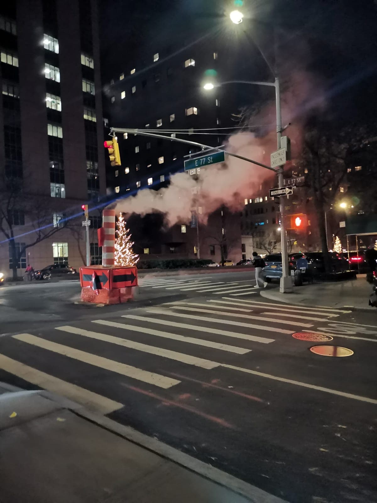 The Met at nightfall, then steam rising from the street.