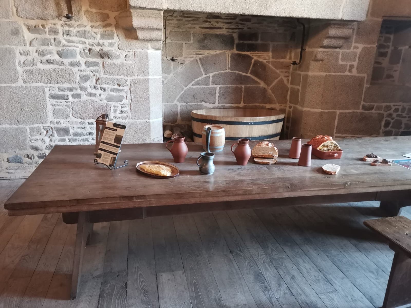 A table laid as in the Middle Ages, inside the walls.