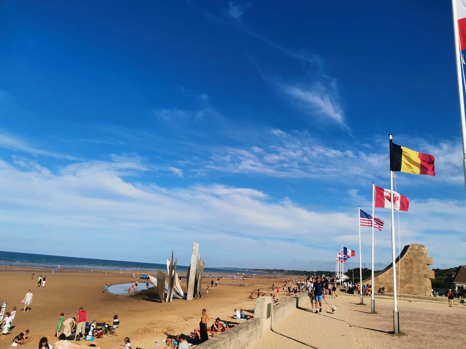 6:14 pm. The flags of the Allied nations, facing the sea.