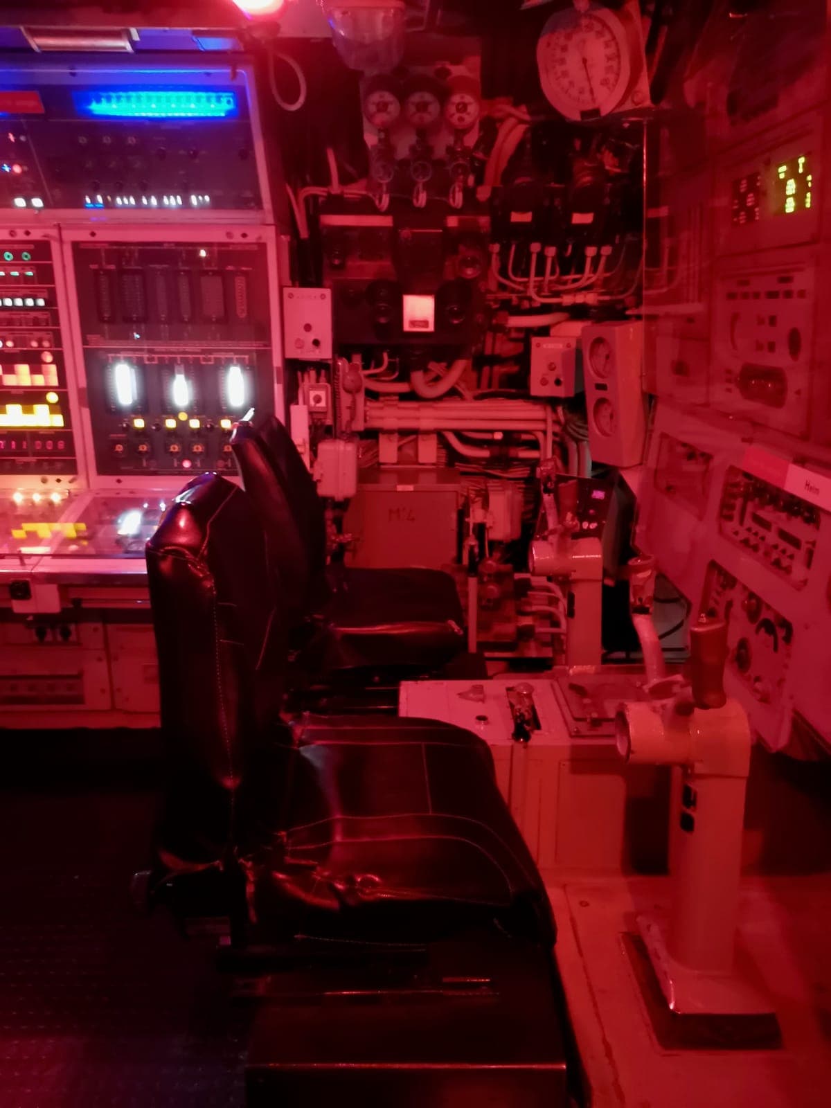 Le Redoutable, France’s first nuclear submarine, and its control room under red light.