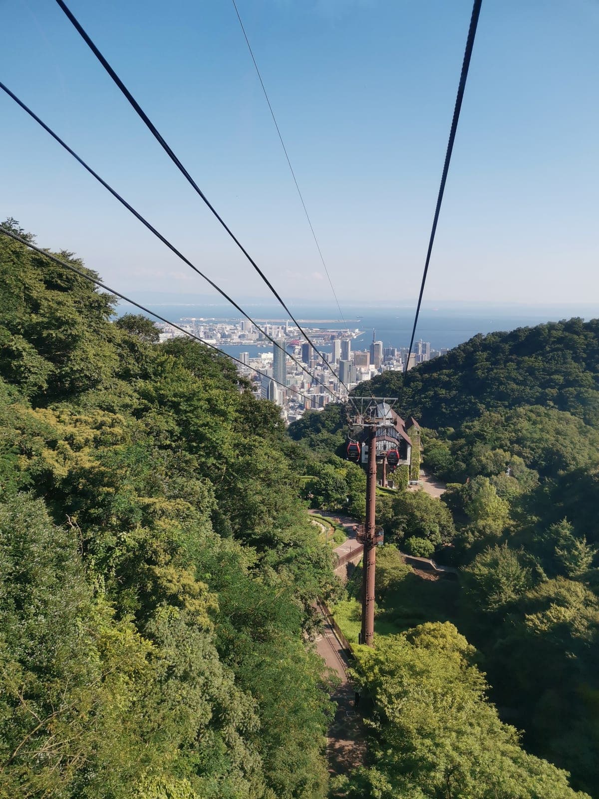 3:57 pm. The ropeway up to the herb gardens, Kobe behind me.