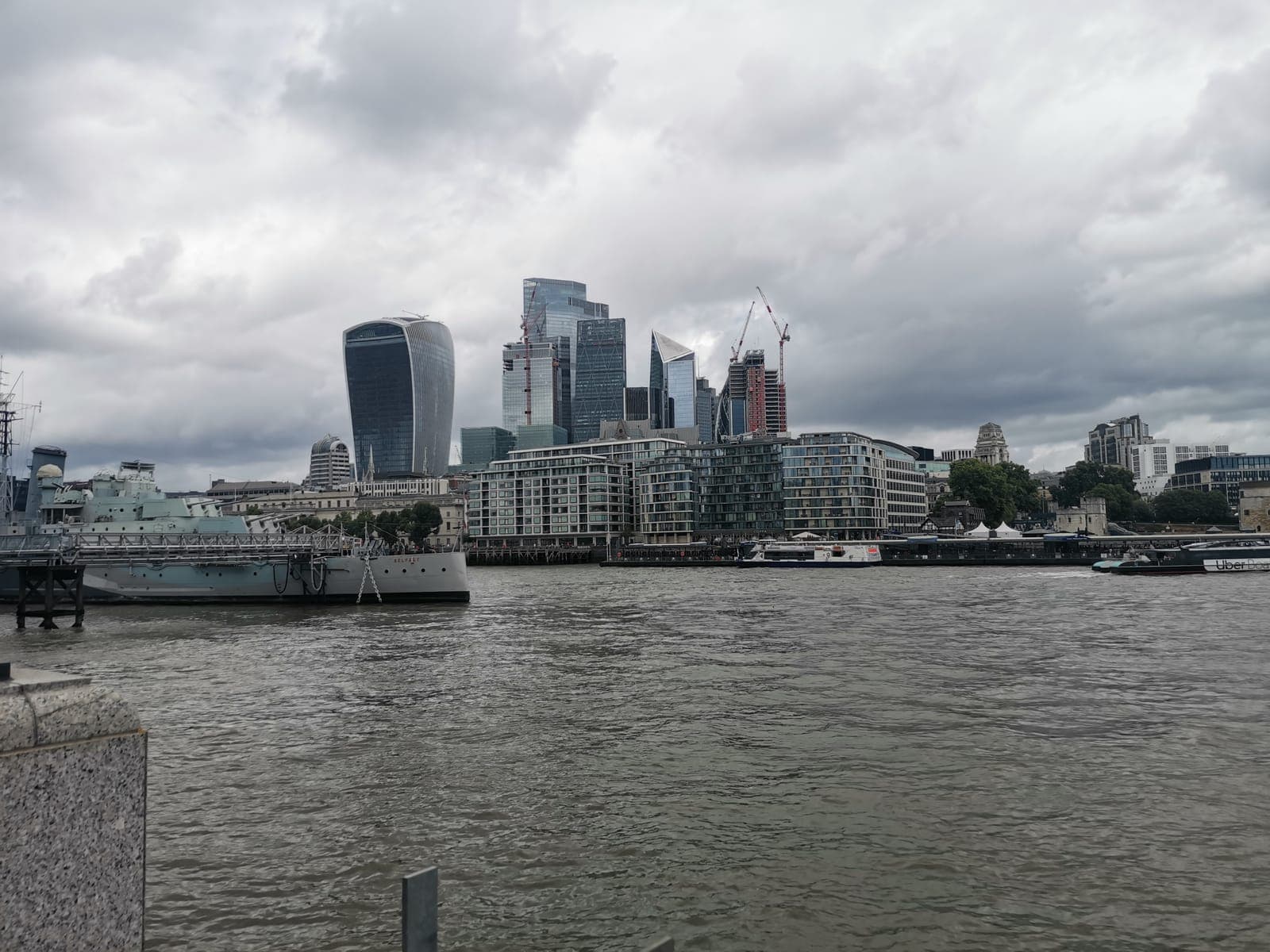 An old warship moored in front of the City’s towers. And the Shard, sticking out behind City Hall.