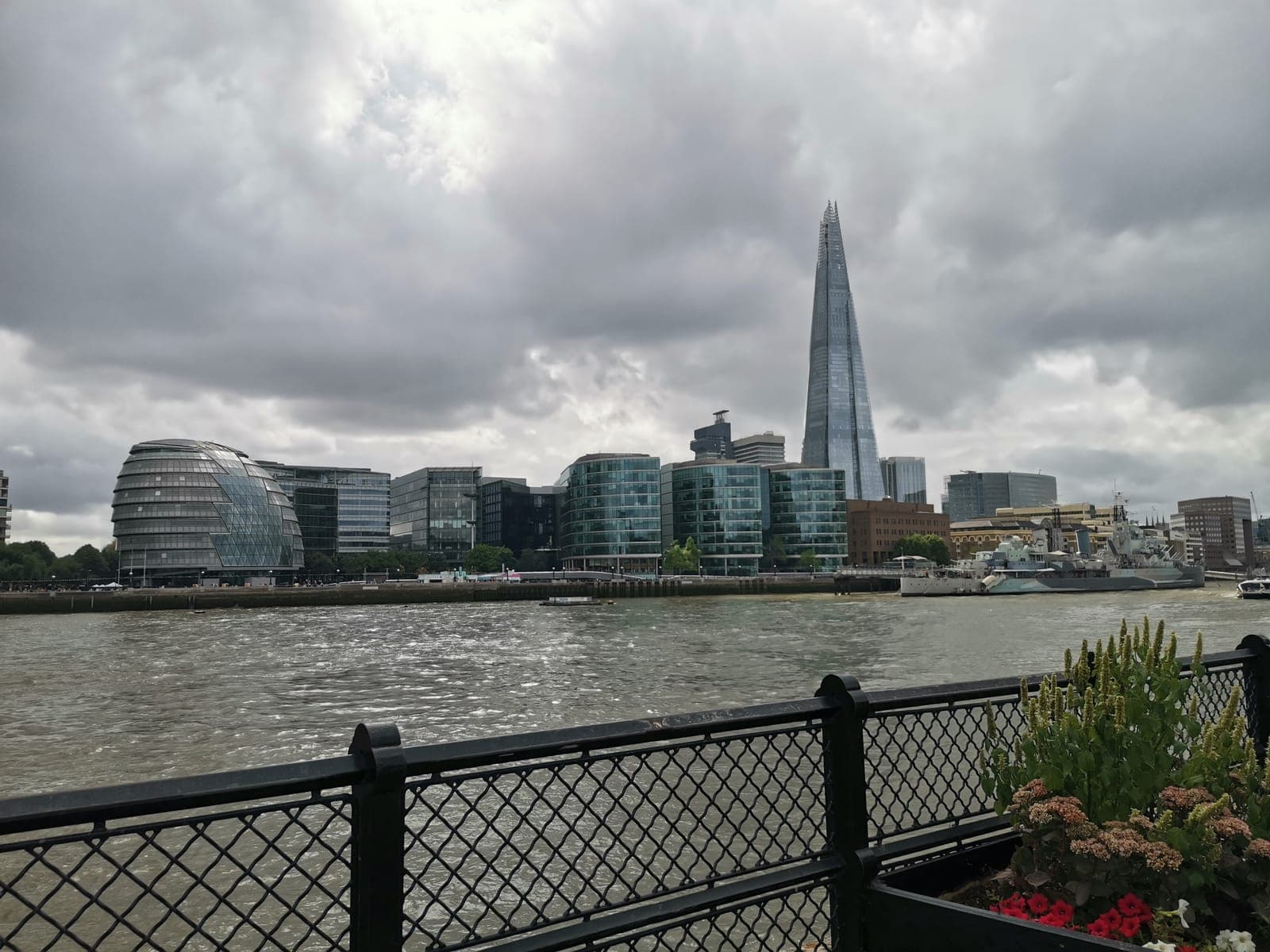 An old warship moored in front of the City’s towers. And the Shard, sticking out behind City Hall.