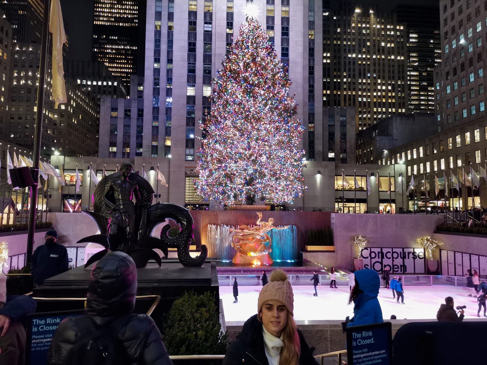 5:54 pm, in the evening. The Rockefeller Center tree above the rink.