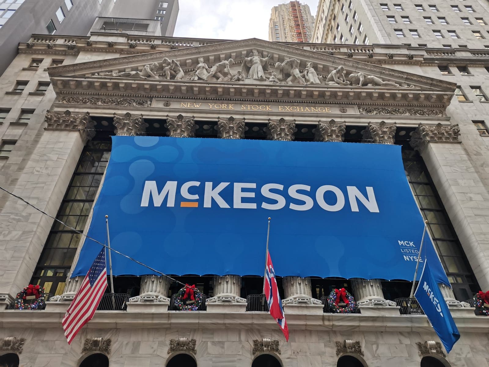 The New York Stock Exchange, and a yellow school bus two streets away.