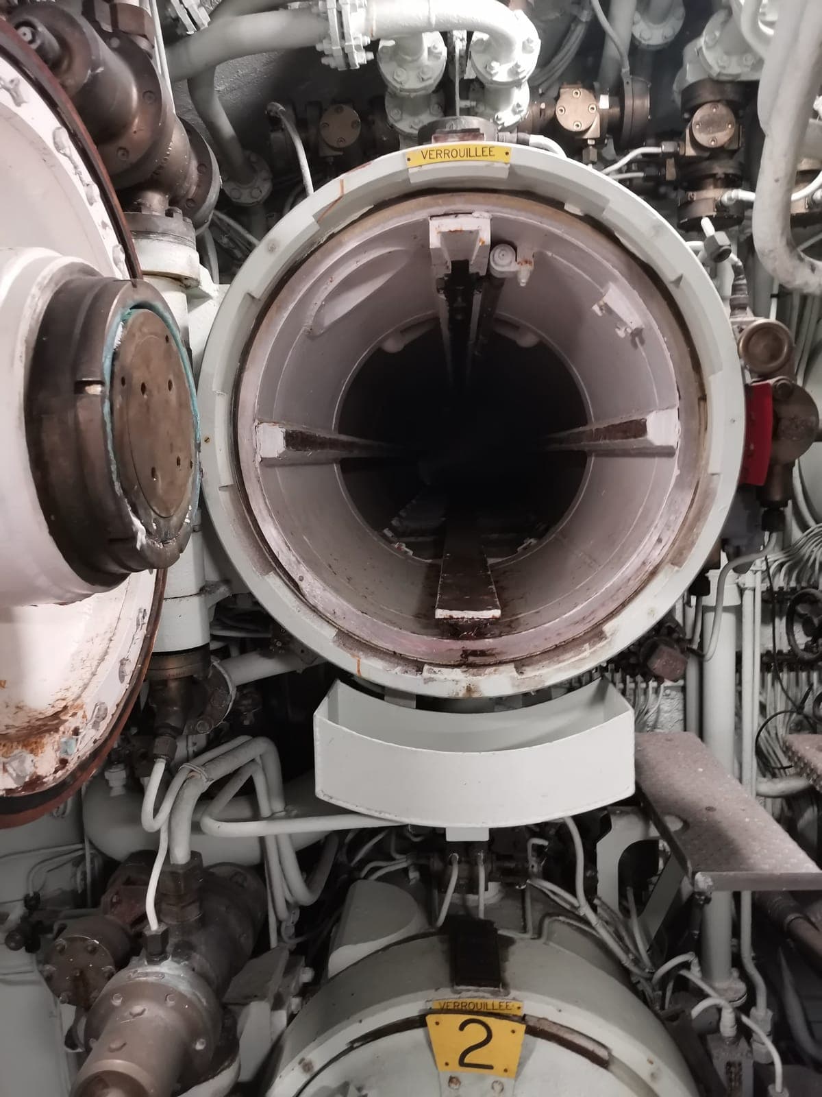The torpedo tubes, at the bow.